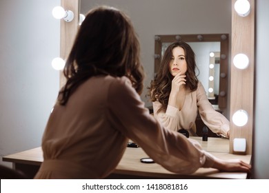 Beautiful Girl Sitting In The Boudoir