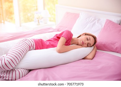 Beautiful Girl Sleeping With Body Pillow In Bedroom