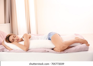 Beautiful Girl Sleeping With Body Pillow In Bedroom