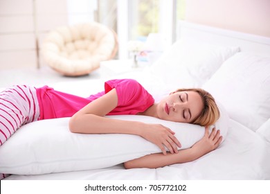 Beautiful Girl Sleeping With Body Pillow In Bedroom