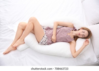 Beautiful Girl Sleeping With Body Pillow In Bedroom