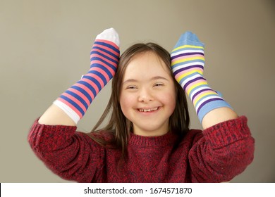 Beautiful Girl Smiling With Different Socks