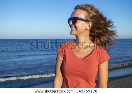 Similar – Portrait of a young woman on the beach