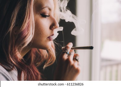 Beautiful Girl Smoking Cannabis Joint