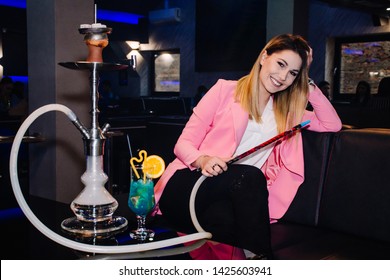 Beautiful Girl Smoking Shisha At A Club