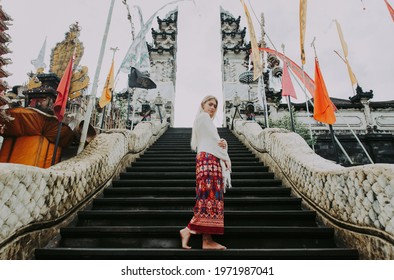 Beautiful girl spending time at the Heaven s door gates at  Lempuyang, Bali