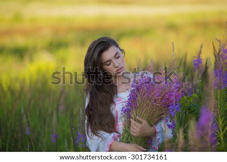 Similar – Woman posing in field of white flowers