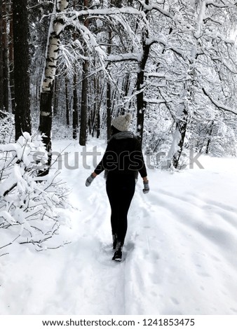 Similar – Image, Stock Photo Girl waiting at the side of the snowy mountain road looking down