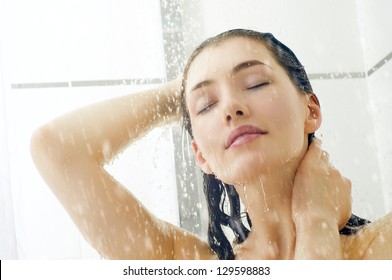 a beautiful girl standing at the shower - Shutterstock ID 129598883