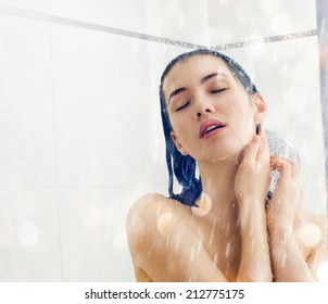 a beautiful girl standing at the shower