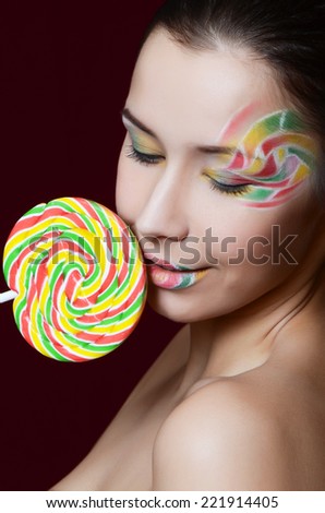 The beautiful girl with a sugar candy