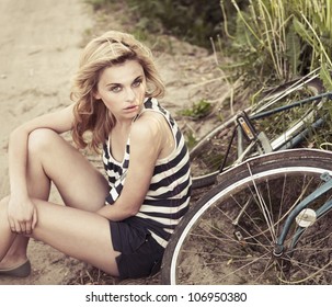 beautiful girl in the summer around Bike