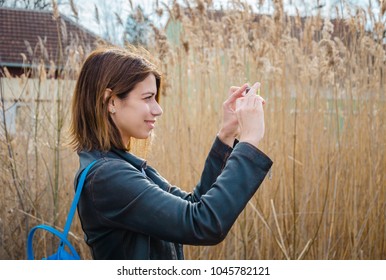 Beautiful girl taking photo