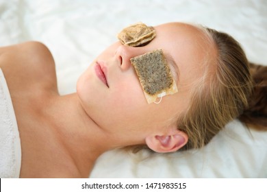 Beautiful Girl With Tea Bags On Eyes. Top View.