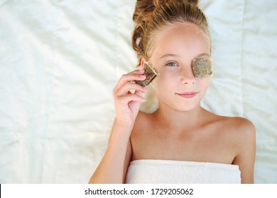 Beautiful Girl With Tea Bags On Eyes. Top View.