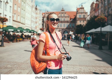 Beautiful girl tourist in the city portrait - Powered by Shutterstock