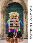 Beautiful girl with traditional dress from Peruvian Andes culture. Young girl in Ollantaytambo city in Incas Sacred Valley in Cusco Peru.