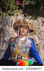 Beautiful girl with traditional dress from Peruvian Andes culture. Young girl in Ollantaytambo city in Incas Sacred Valley in Cusco Peru. - Shutterstock ID 2292484477