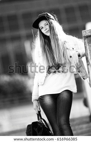 Similar – Image, Stock Photo Smiling young woman in urban background