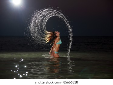 Beautiful Girl In The Water Waving Hair