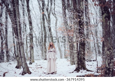 beautiful girl in the winter outdoors. Christmas. Shallow depth of field. fairy tale