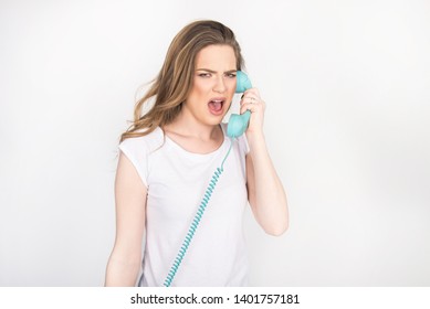 Beautiful Girl, Young Adult, Smiling And Screaming Over The Phone, Holding Blue Land Line Phone Telephone Headset, Horizontal Isolated On White, Blond Model