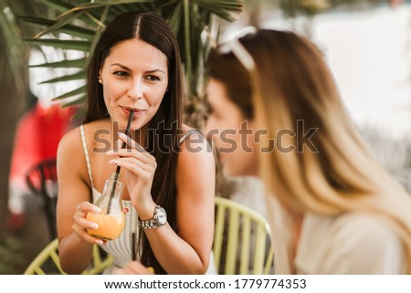 Similar – Young women couple drinking healthy drinks outdoors