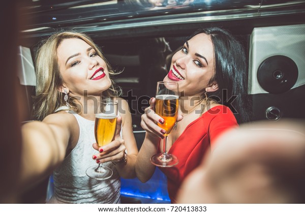 Beautiful girls\
making party in the\
limousine