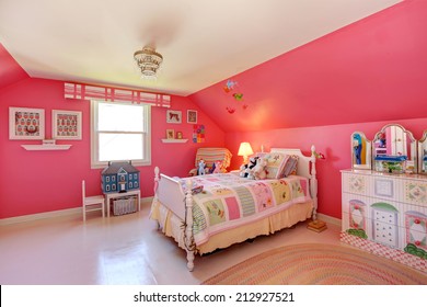 Beautiful Girls Room In Bright Pink Color With Carved Wood Bed And Toys