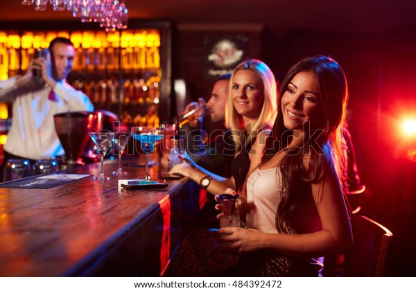 Beautiful Girls Sit Bar While Bartender Stock Photo Edit - 