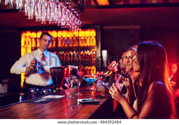 Beautiful Girls Sit Bar While Bartender Stock Photo Edit Now