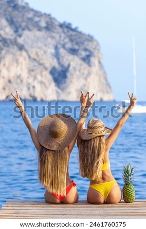beautiful girls summer vacation in bikini and sun hats