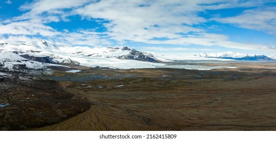 Beautiful Glaciers Flow Through The Mountains In Iceland. Aerial View And Top View.