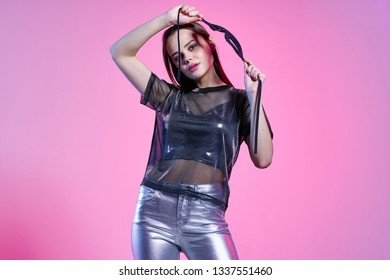 Beautiful Glamor Woman In Silver Lake And In A Transparent T-shirt Purple Disco Party Background