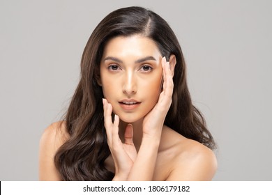 Beautiful Glamour Indian Woman Touch Cheek Smile With Clean And Fresh Skin Happiness And Cheerful With Positive Emotional,isolated On Grey Background,Beauty Cosmetics And Spa Facial Treatment Concept