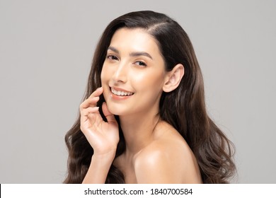 Beautiful Glamour indian woman touch cheek smile with clean and fresh skin Happiness and cheerful with positive emotional,isolate on grey background,Beauty Cosmetics and spa Facial treatment Concept