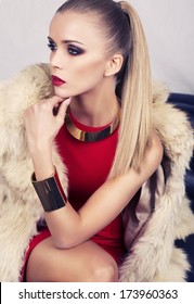 Beautiful Glamour Woman In Red Dress With Fur Coat