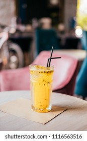 Beautiful Glass Of Yellow Passionfruit Lemonade On The Wooden Table. Flatlay Style, Spotted On The City Cafe.