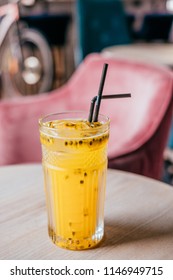 Beautiful Glass Of Yellow Passionfruit Lemonade On The Wooden Table. Flatlay Style, Spotted On The City Cafe.