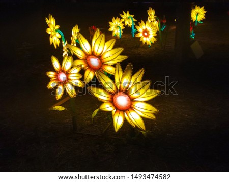 Beautiful glowing yellow artificial flower.garden light installations