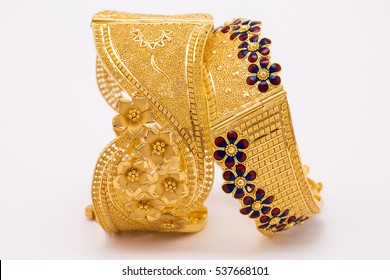Beautiful gold bangle isolated on white background. 