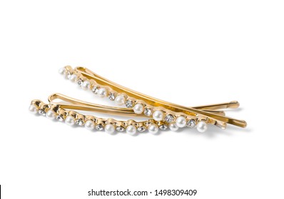 Beautiful gold hair pins with gems on white background