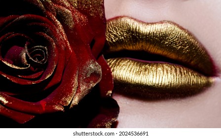 Beautiful Gold Lips With Red Rose Close-up. Valentine Day. Gold Lips With Sexy Smirk. Textured Lips With Gloss Lipstick. Passionate Lips With Red Rose