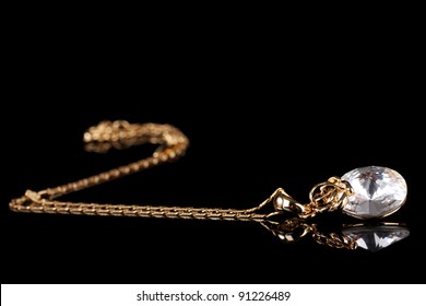 Beautiful Gold Necklace With Gem On Black Background