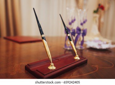 Beautiful Gold Pen On A Wooden Stand