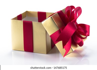 Beautiful Gold Present Box With Red Bow And Ribbons On White Backgound