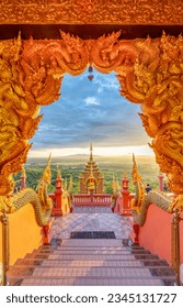 Beautiful golden sunlight shines on the majestic architecture of Wat Phra That Doi Phrachan, Lampang Province, Thailand. - Shutterstock ID 2345131727