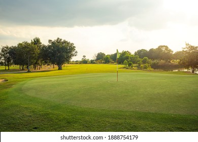Beautiful golf course in a sunny day. Background evening golf course has sunlight shining down. Golf course in the countryside                               