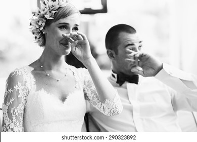 beautiful gorgeous blonde bride and stylish groom crying,  celebrating wedding on the restaurant terrace - Powered by Shutterstock