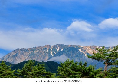 Beautiful Goryudake Montain With Snow In Hakuba Villege In Summer